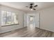 This bedroom has sleek floors, neutral walls, and big windows at 13792 E Lehigh Ave # E, Aurora, CO 80014