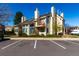 Well-maintained exterior with a balcony, lush landscaping, and ample parking at 13792 E Lehigh Ave # E, Aurora, CO 80014