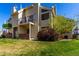 Exterior view of a home with a grassy yard at 13792 E Lehigh Ave # E, Aurora, CO 80014