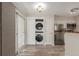 Convenient laundry area with stacked washer and dryer in the kitchen at 13792 E Lehigh Ave # E, Aurora, CO 80014