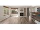 Bright living room with fireplace, bar seating and modern flooring at 13792 E Lehigh Ave # E, Aurora, CO 80014