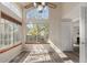 Living room featuring big windows, wood trim, and an open floor plan at 13792 E Lehigh Ave # E, Aurora, CO 80014