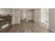 Open living space with new flooring and multiple access points at 13792 E Lehigh Ave # E, Aurora, CO 80014