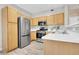 Modern kitchen with stainless steel appliances and light wood cabinets at 1050 Opal St # 102, Broomfield, CO 80020