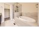 Bathroom features an alcove tub and shower with tile surround at 600 E Dry Creek Pl, Littleton, CO 80122