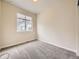 Bright bedroom with neutral walls, soft carpet, and a window that offers ample natural light at 600 E Dry Creek Pl, Littleton, CO 80122