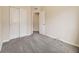 Cozy bedroom featuring neutral walls, carpet flooring and a closet at 600 E Dry Creek Pl, Littleton, CO 80122