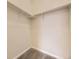 Walk-in closet with carpet and metal shelving at 600 E Dry Creek Pl, Littleton, CO 80122