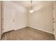 Cozy dining area featuring wood floors and a classic chandelier at 600 E Dry Creek Pl, Littleton, CO 80122