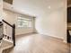 Bright living area boasts wood floors and a large window for ample natural light at 600 E Dry Creek Pl, Littleton, CO 80122