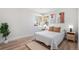 Naturally lit bedroom with hardwood floors offers comfort and charm at 862 Pontiac St, Denver, CO 80220