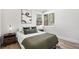This home's bedroom features hardwood floors, a large window, and ample space for rest and relaxation at 862 Pontiac St, Denver, CO 80220