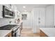 This home's bright kitchen features stainless steel appliances, wood cabinets, and durable countertops at 862 Pontiac St, Denver, CO 80220