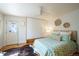 Bright bedroom showcasing hardwood floors, a ceiling fan, a closet and a door to the backyard at 3735 Inca St, Denver, CO 80211
