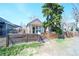 Charming studio home with a fenced yard, and wooden pergola entrance at 3735 Inca St, Denver, CO 80211
