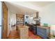 Modern kitchen boasts a tiled backsplash, stainless steel appliances, and an island with a butcher block countertop at 3735 Inca St, Denver, CO 80211