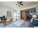 Cozy living room with a modern kitchen and dining area. Stylish and bright! at 3735 Inca St, Denver, CO 80211