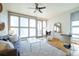 Bright living room with large windows, modern furniture, and hardwood floors at 3735 Inca St, Denver, CO 80211