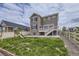Backyard view of the home's exterior, deck, patio, and play structure at 4433 N Picadilly Ct, Aurora, CO 80019