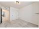 Bright bedroom featuring neutral carpet, white walls and a sliding door closet at 4433 N Picadilly Ct, Aurora, CO 80019