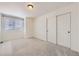 Bedroom featuring a window and closet at 4433 N Picadilly Ct, Aurora, CO 80019