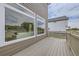 A view of the wood deck showcasing large windows at 4433 N Picadilly Ct, Aurora, CO 80019
