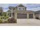 Beautiful two-story home featuring a three-car garage and stone accents at 4433 N Picadilly Ct, Aurora, CO 80019