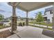 Covered front porch with stone pillars, offering a glimpse of the neighborhood at 4433 N Picadilly Ct, Aurora, CO 80019