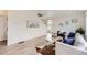 Bright and airy living room featuring hardwood floors and neutral decor at 4433 N Picadilly Ct, Aurora, CO 80019