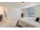 Comfortable main bedroom with an attached bath and closet, a neutral color scheme, and soft carpeting at 4433 N Picadilly Ct, Aurora, CO 80019