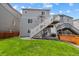 Large backyard with deck and stairs at 3344 Evening Pl, Castle Rock, CO 80109