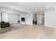 Spacious basement with mixed flooring and a sliding barn door at 3344 Evening Pl, Castle Rock, CO 80109