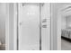 Modern shower with glass door and white tile at 3344 Evening Pl, Castle Rock, CO 80109