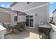 Outdoor deck area with a dining table, chairs, and grill perfect for outdoor dining at 3344 Evening Pl, Castle Rock, CO 80109