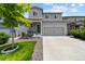 Charming two-story home with a well-maintained lawn and a two car garage in a desirable neighborhood at 3344 Evening Pl, Castle Rock, CO 80109