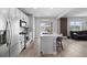 Bright kitchen featuring stainless steel appliances, center island, and open floor plan at 3344 Evening Pl, Castle Rock, CO 80109