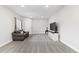 Bright living room features neutral walls, plush carpet, and a modern entertainment center at 3344 Evening Pl, Castle Rock, CO 80109