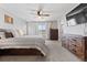 Serene main bedroom with a ceiling fan, plush carpet, and natural wood furnishings at 3344 Evening Pl, Castle Rock, CO 80109