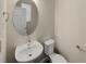 Powder room with pedestal sink and toilet at 4723 Joplin St, Denver, CO 80239