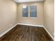 Small bedroom with hardwood floors and windows at 4723 Joplin St, Denver, CO 80239