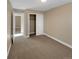 Bedroom with carpet flooring and access to a hallway at 4723 Joplin St, Denver, CO 80239