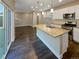 Modern kitchen with granite countertops, stainless steel appliances, and an island at 4723 Joplin St, Denver, CO 80239