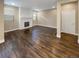 Spacious living room featuring hardwood floors and a fireplace at 4723 Joplin St, Denver, CO 80239