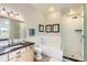Well-lit bathroom featuring a bathtub and shower combo, vanity with sink, and updated fixtures at 8392 Niwot Meadow Farm Rd, Niwot, CO 80503