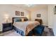 Comfortable bedroom with a queen bed, colorful pillows and an ottoman bench for relaxed sleeping at 8392 Niwot Meadow Farm Rd, Niwot, CO 80503