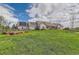 Expansive home with solar panels, fenced yard, and well-manicured lawn on a sunny day at 8392 Niwot Meadow Farm Rd, Niwot, CO 80503