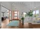 Bright entryway featuring high ceilings, hardwood floors, and a modern chandelier at 8392 Niwot Meadow Farm Rd, Niwot, CO 80503
