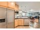 Spacious eat-in kitchen features stainless steel appliances, light wood cabinets and eat-in dining at 8392 Niwot Meadow Farm Rd, Niwot, CO 80503
