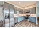 Modern kitchen features sleek stainless steel appliances, updated cabinets, and stylish hardwood floors at 8392 Niwot Meadow Farm Rd, Niwot, CO 80503