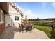 Outdoor patio with dining set, umbrella, and views of adjacent fenced pasture in a lovely home at 8392 Niwot Meadow Farm Rd, Niwot, CO 80503